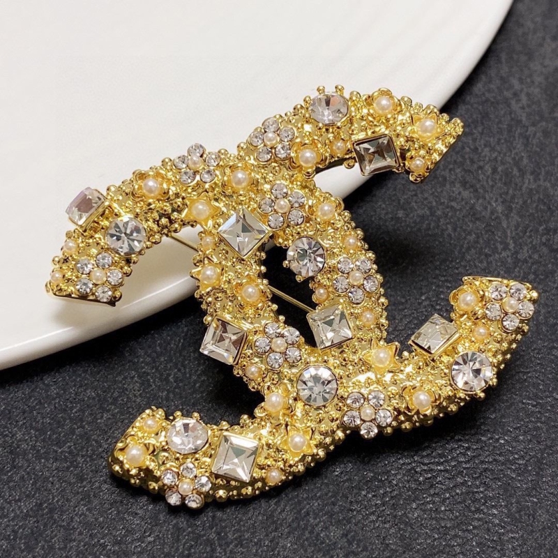 Ch**el brooches